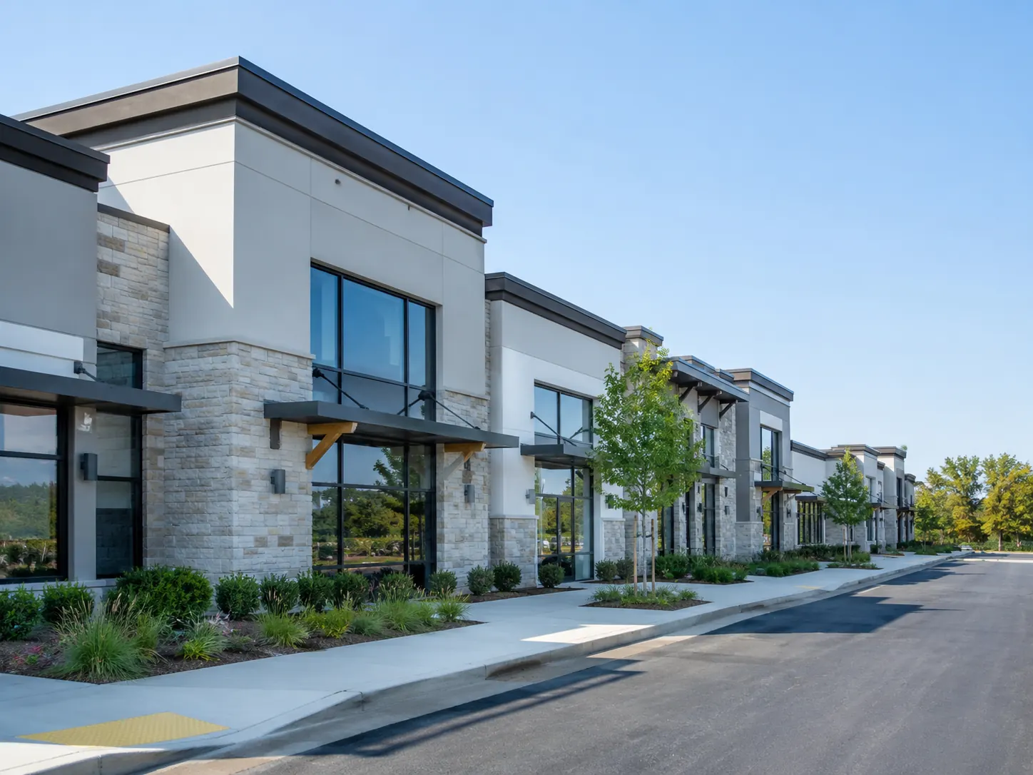 A row of single-level office condominium units with glass storefronts.